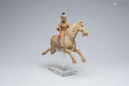 A Chinese polychrome painted pottery equestrian figure, Tang