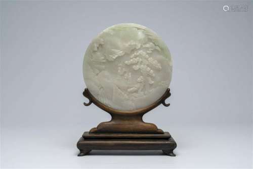 A large Chinese white jade plaque with figures in a landscap...