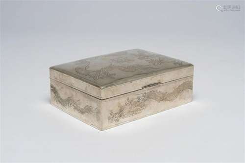 A Chinese silver box and cover with engraved dragon design, ...