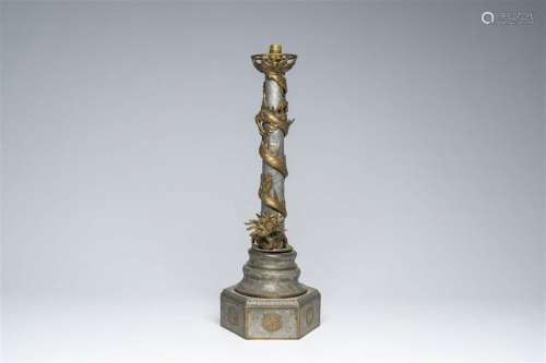 A Chinese pewter lamp base with a brass dragon in relief, fi...