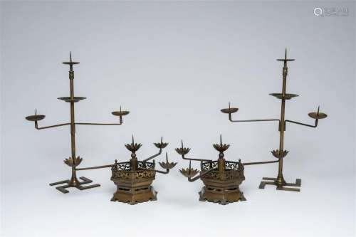 Two pairs of Chinese bronze and brass three- and four-light ...