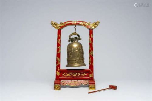 A Chinese gilt and lacquered wood table bell stand and a bro...