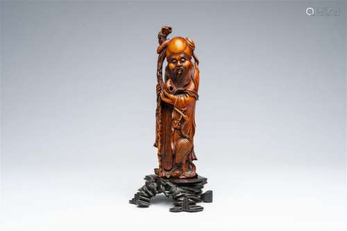 A Chinese carved wood group of Shou Lao with a crane, 19th C...