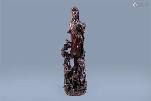 A massive Chinese carved wood group with a Guanyin, children...