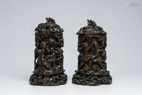 A pair of Chinese wood brush pots with relief design and a p...