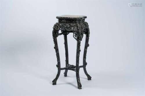 A Chinese reticulated carved wood stand with marble top, 19/...