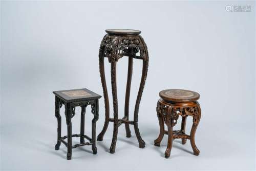Three Chinese open worked carved wood stands with marble top...