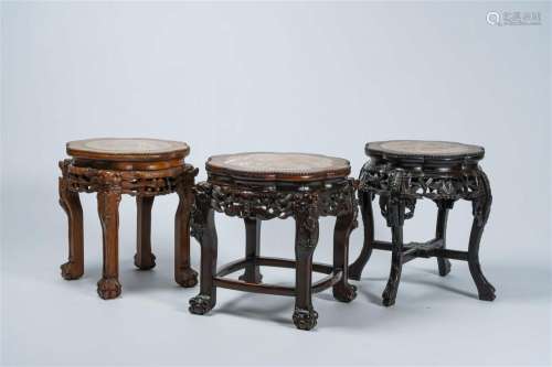 Three Chinese open worked lobed carved wood stands with marb...
