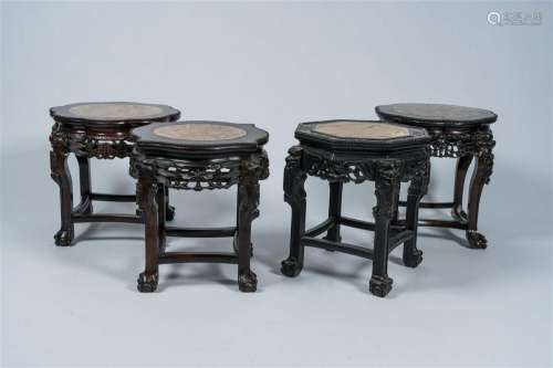 Four Chinese open worked carved wood stands with marble top,...