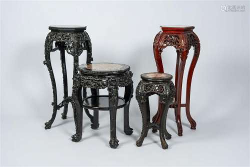 Four Chinese open worked carved wood stands with marble top,...