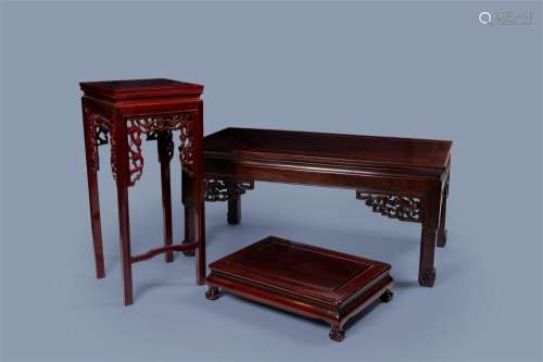 Three Chinese wood display stands and tables, 20th C.