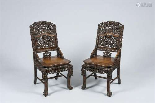 A pair of Chinese carved hardwood 'dragon' chairs, 19th  C.