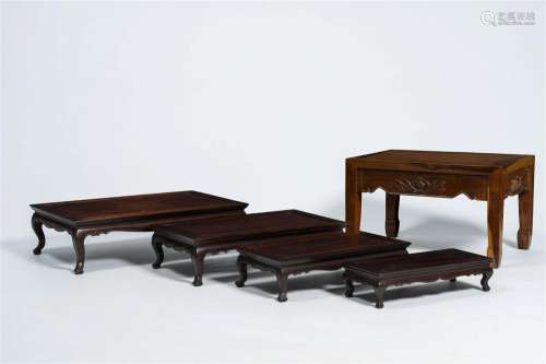Four Chinese rectangular wood nesting tables and a side tabl...