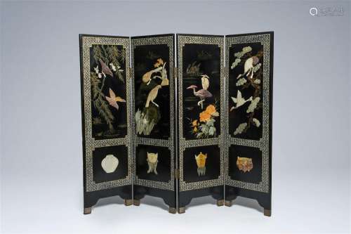 A Chinese four-panel room divider in lacquered and inlaid wo...