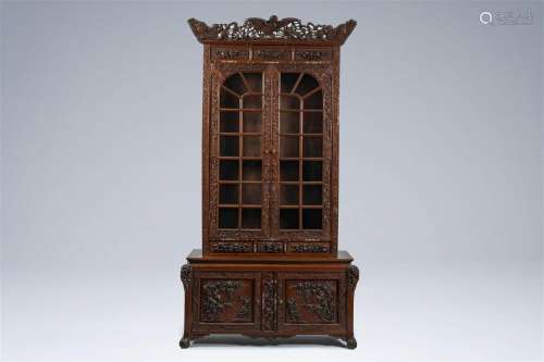 A Chinese or Vietnamese wooden four-door display cabinet wit...