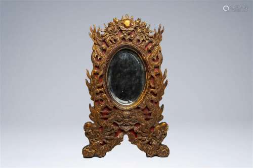 A Chinese gilt and lacquered wood 'dragons chasing the pearl...