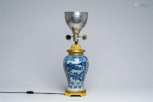 A Chinese blue and white vase with gilt bronze lamp mounts, ...