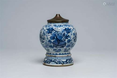 A Chinese blue and white brass mounted vase with floral desi...