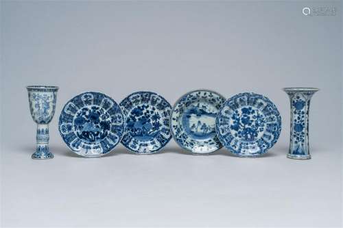 Four Chinese blue and white saucer dishes, a vase and a wine...