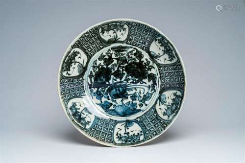 A large Chinese blue and white Swatow charger with a bird am...