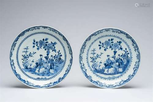 A pair of Chinese blue and white dishes with figures in a ga...