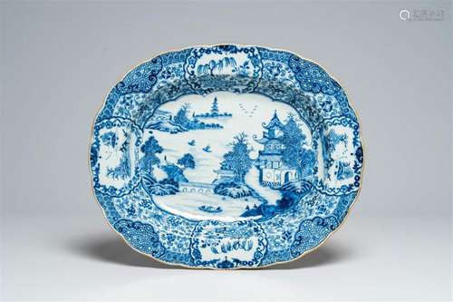 A lobed oval Chinese blue and white deep charger with an ani...