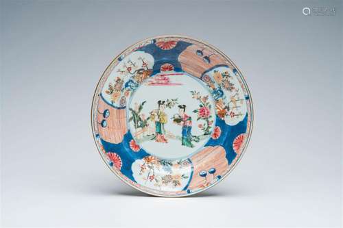 A Chinese rose-Imari plate with ladies in a garden and flora...