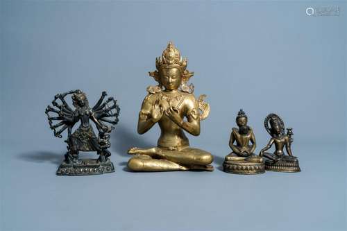 Four various Sino-Tibetan brass and bronze figures, 20th C.