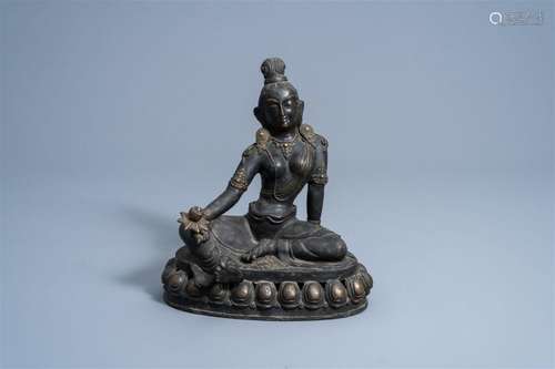 A Sino-Tibetan bronze figure of Tara holding a lotus, 19th/2...