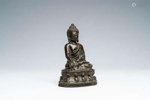 A Nepalese or Tibetan bronze figure of Buddha, 18th/19th C.