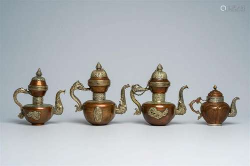 Four Tibetan copper ewers and covers with relief design, 19t...