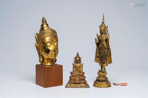Two Thai gilt bronze figures of a standing and a seated Budd...