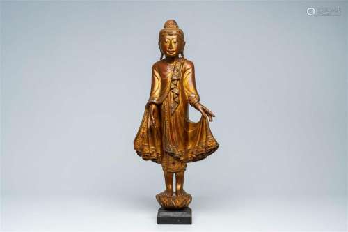 A Thai inlaid gilt wood figure of a standing Buddha, 20th C.
