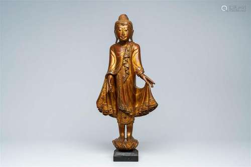 A Thai inlaid gilt wood figure of a standing Buddha, 20th C.