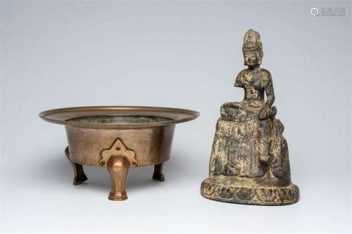 A Korean bronze tripod censer and an iron model of Guanyin, ...