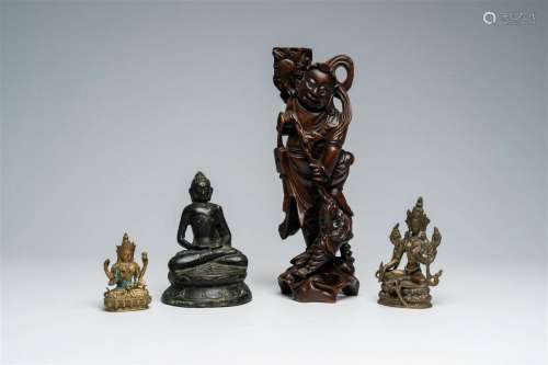 Four Asian bronze and wood sculptures, 19th/20th C.