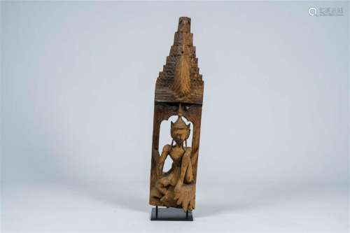 A Southeast Asian wood architectural ornament depicting a se...