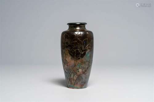 A Japanese silver vase with engraved floral design, characte...