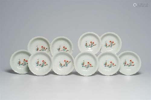 Ten Japanese moulded Kakiemon style bowls with floral design...