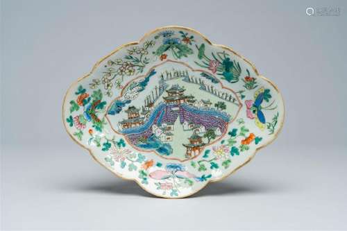 A Chinese famille rose lobed bowl on foot with a landscape w...