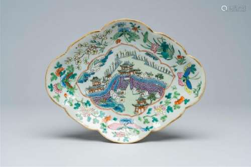 A Chinese famille rose lobed bowl on foot with a landscape w...