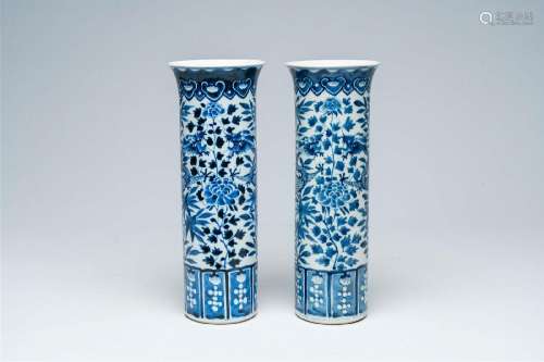 A pair of Chinese blue and white sleeve vases with dragons a...