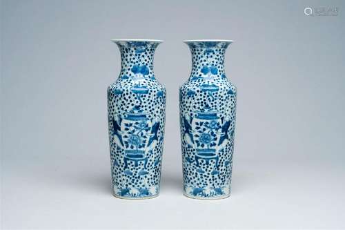 A pair of Chinese blue and white vases with boys and antiqui...