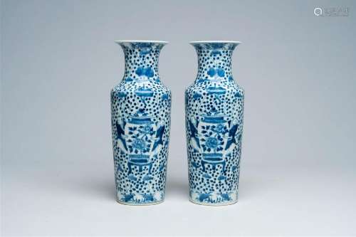 A pair of Chinese blue and white vases with boys and antiqui...