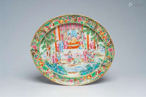 An oval Chinese Canton famille rose charger with a palace sc...