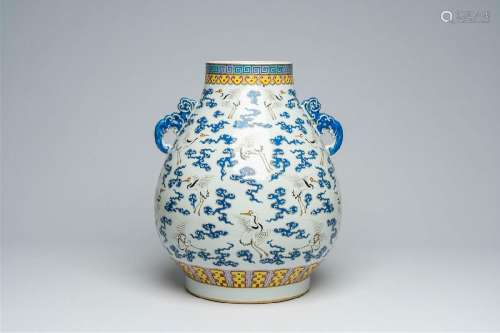 A Chinese famille rose 'hu' vase with cranes between clouds,...
