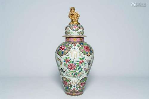 A large French famille rose style vase and cover with butter...