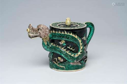 A Chinese famille noire dragon-shaped teapot with relief des...