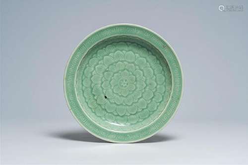 A Chinese celadon dish with incised lotus design, 19th C.