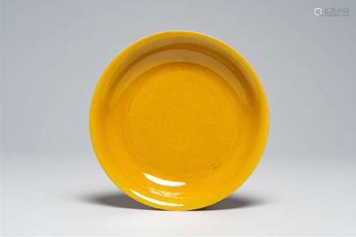 A Chinese monochrome yellow plate, Zhengde mark, 19th/20th C...